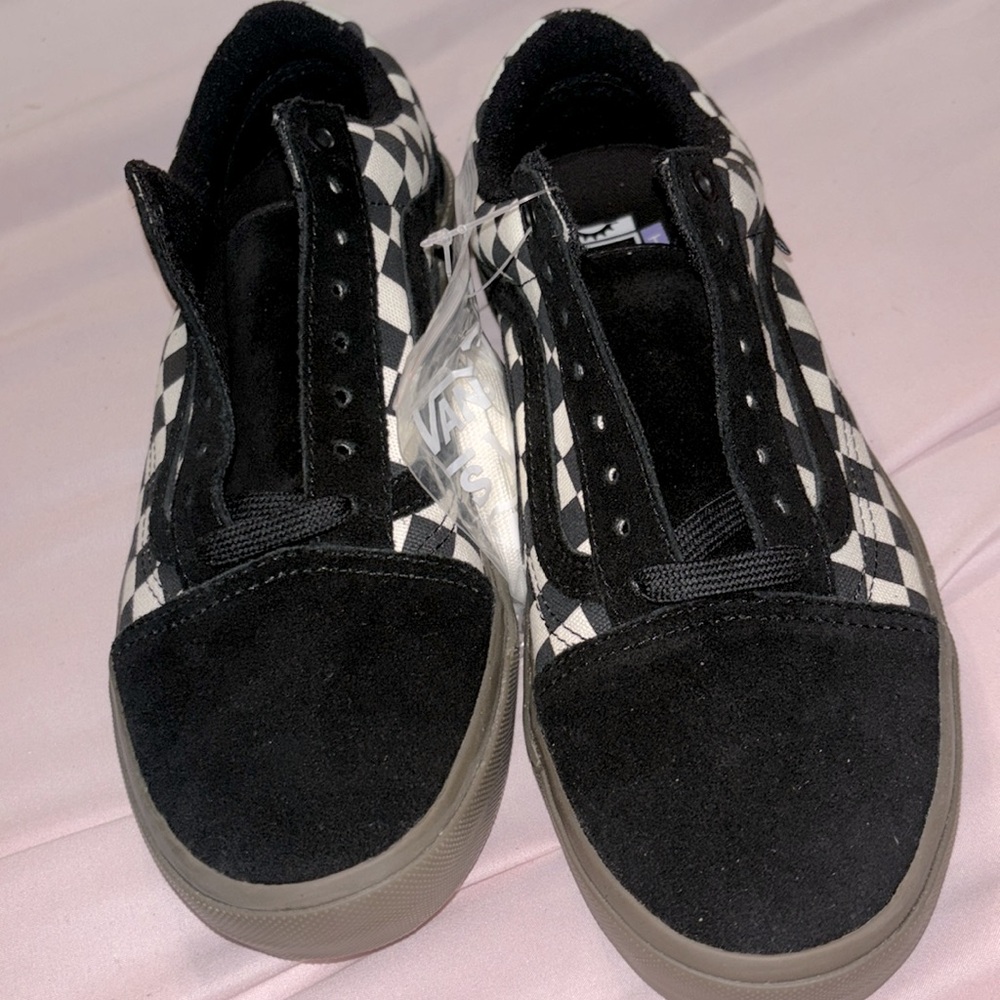 Brand new vans with no box. Black and black checkered. Black check classic vans